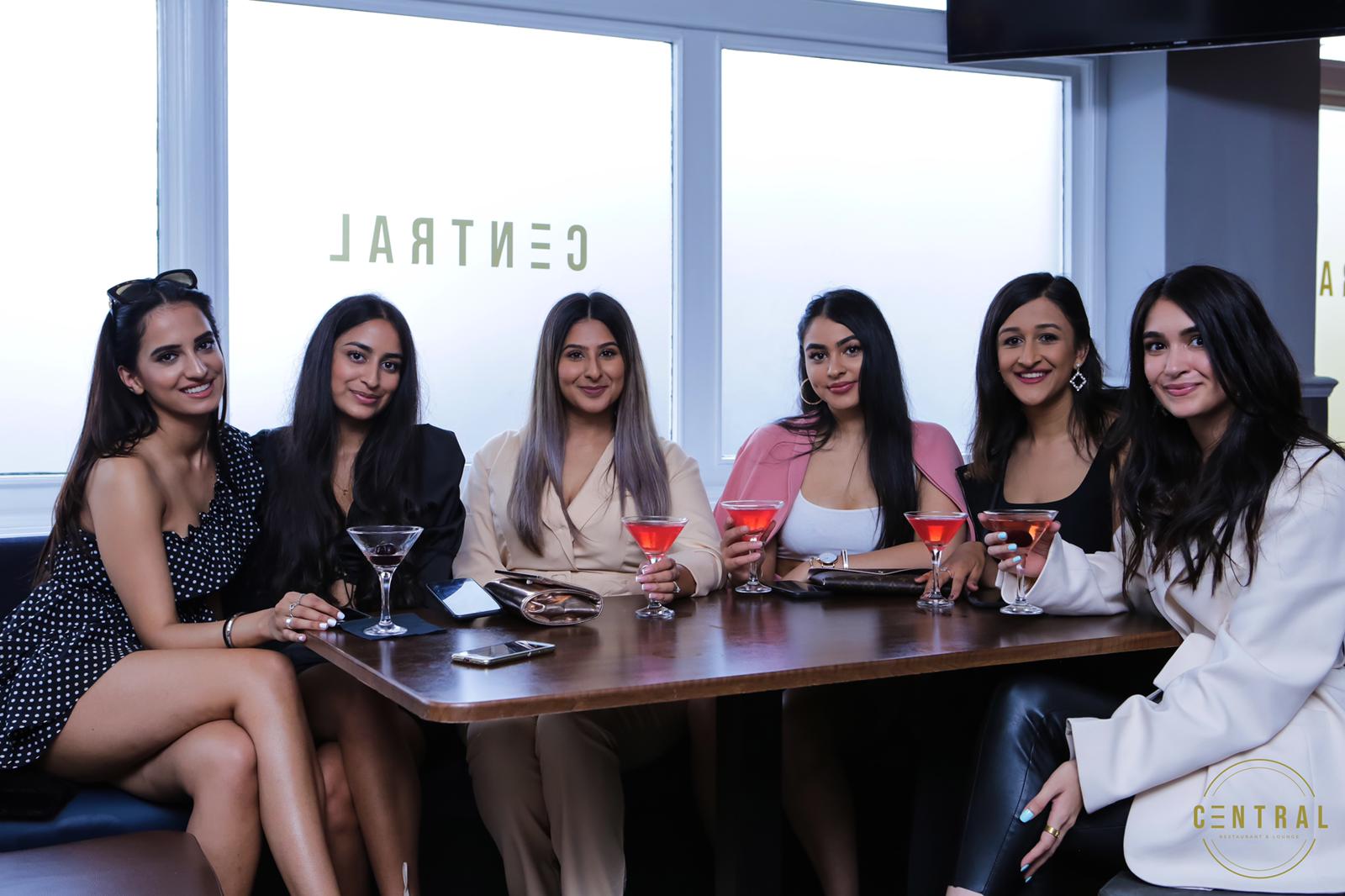 A group of friends celebrating at a table at Central